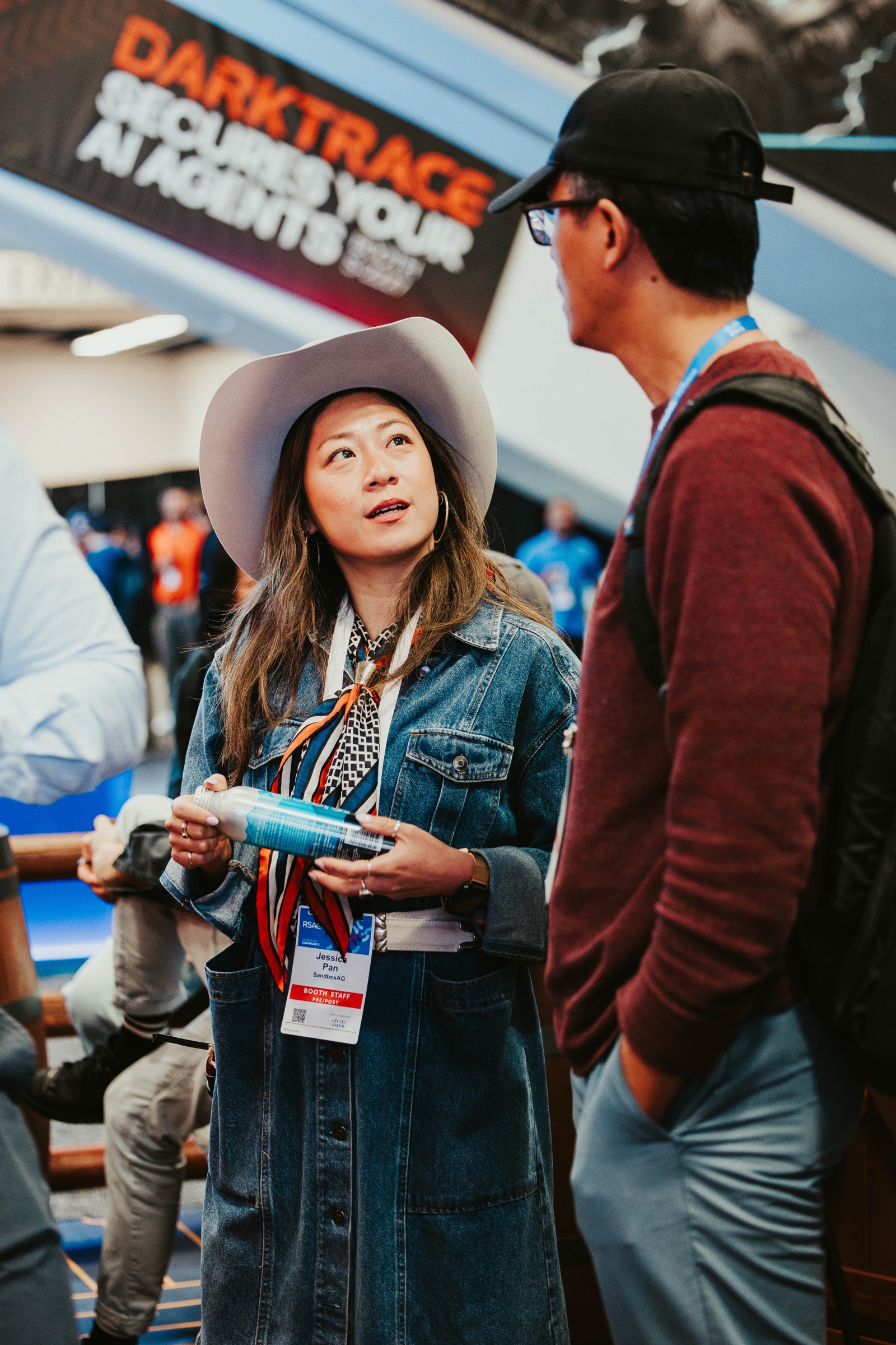 Visitor in a cowboy hat at the SandboxAQ booth on the RSA show floor