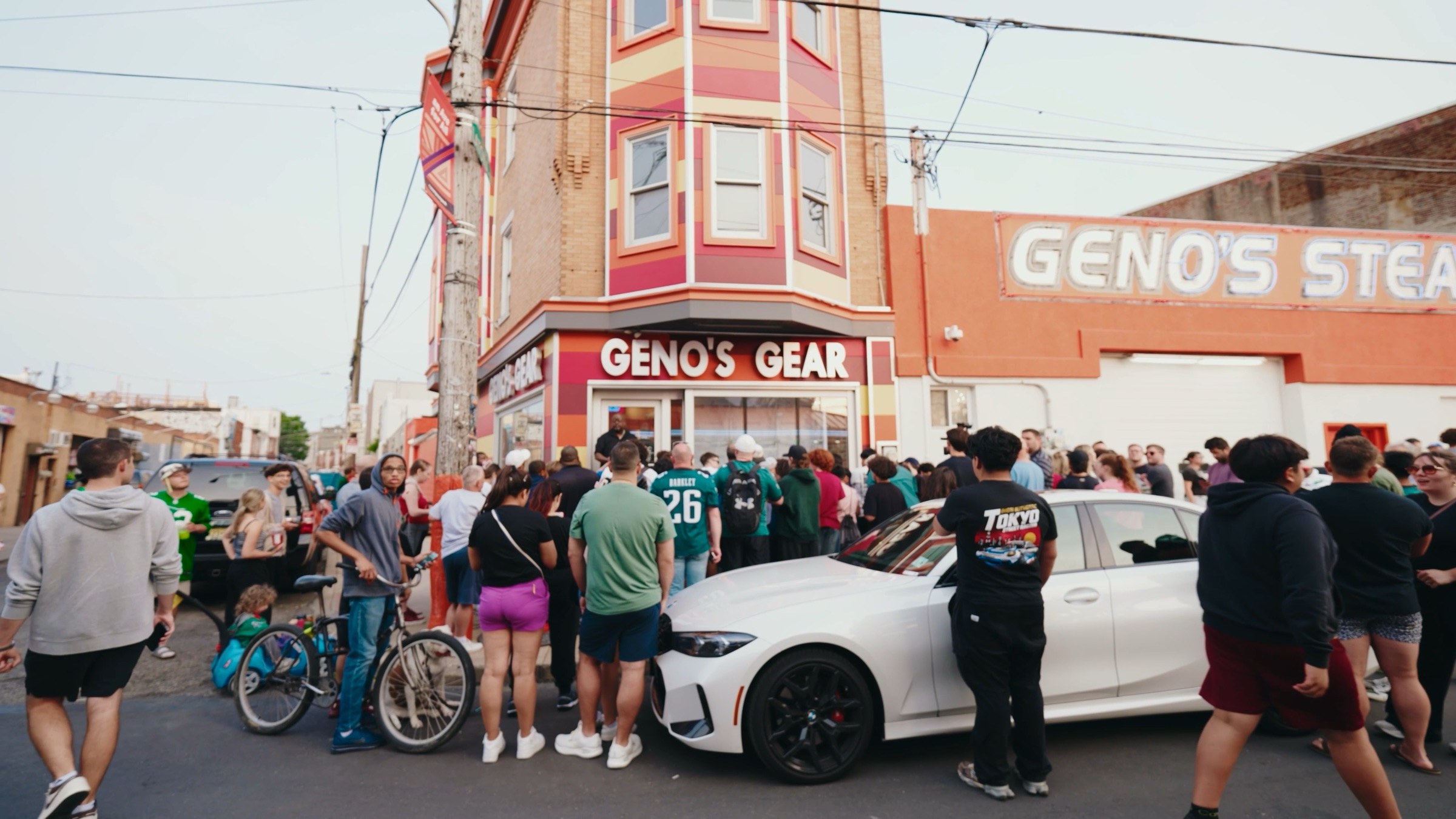 Crowd gathered outside Geno's Steaks during the Madden NFL 26 takeover