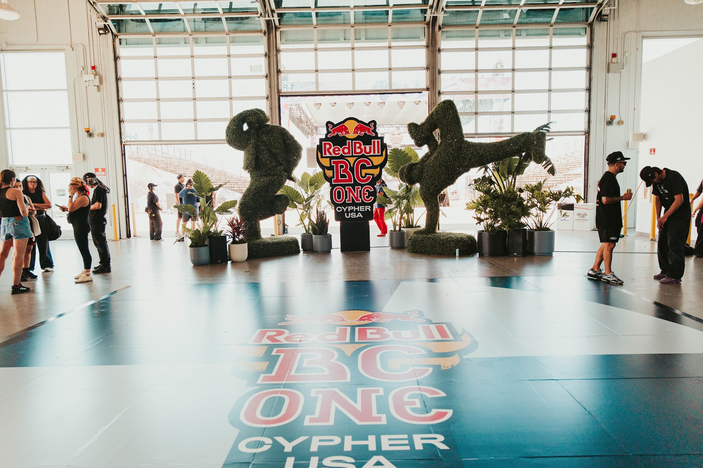 Topiary breakers flank the BC One Cypher USA logo inside Port Pavilion