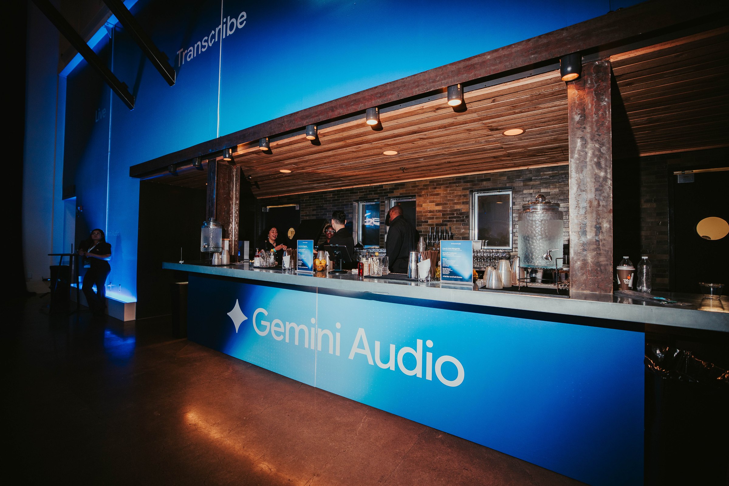 The Gemini Audio bar at The Pearl, wrapped in the event's blue gradient artwork