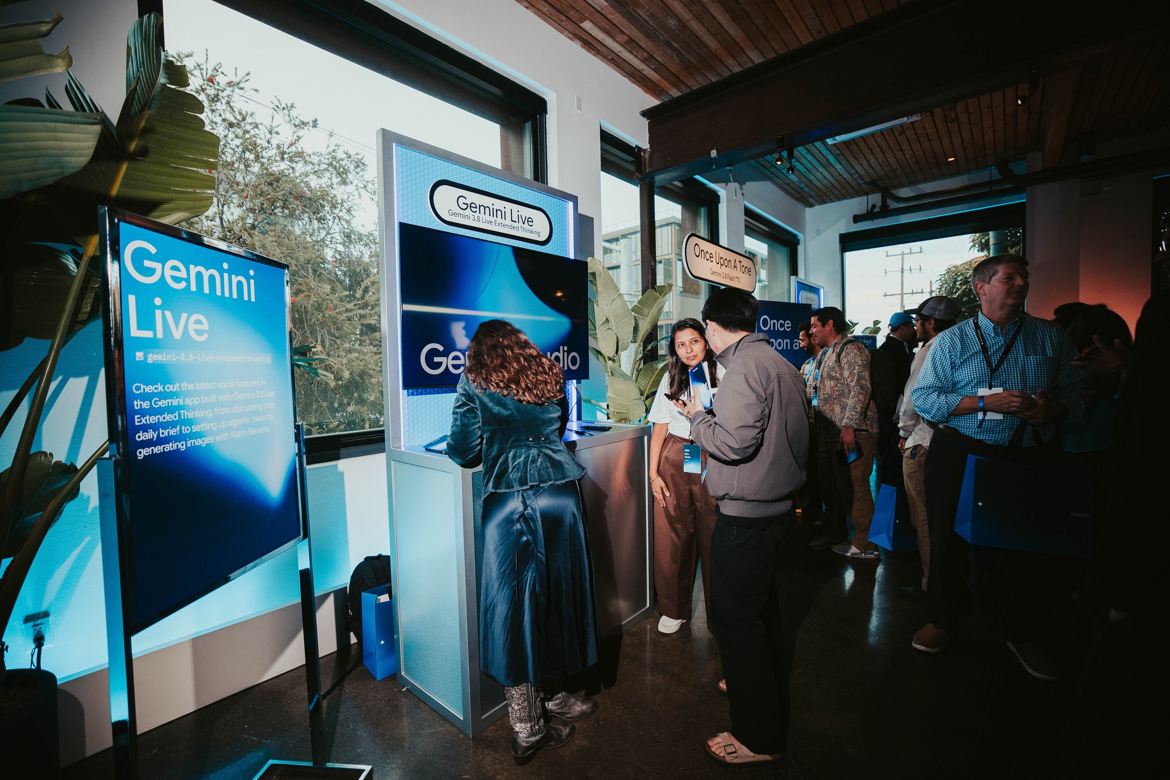 Guests try the Gemini Live demo station beside Once Upon A Tone