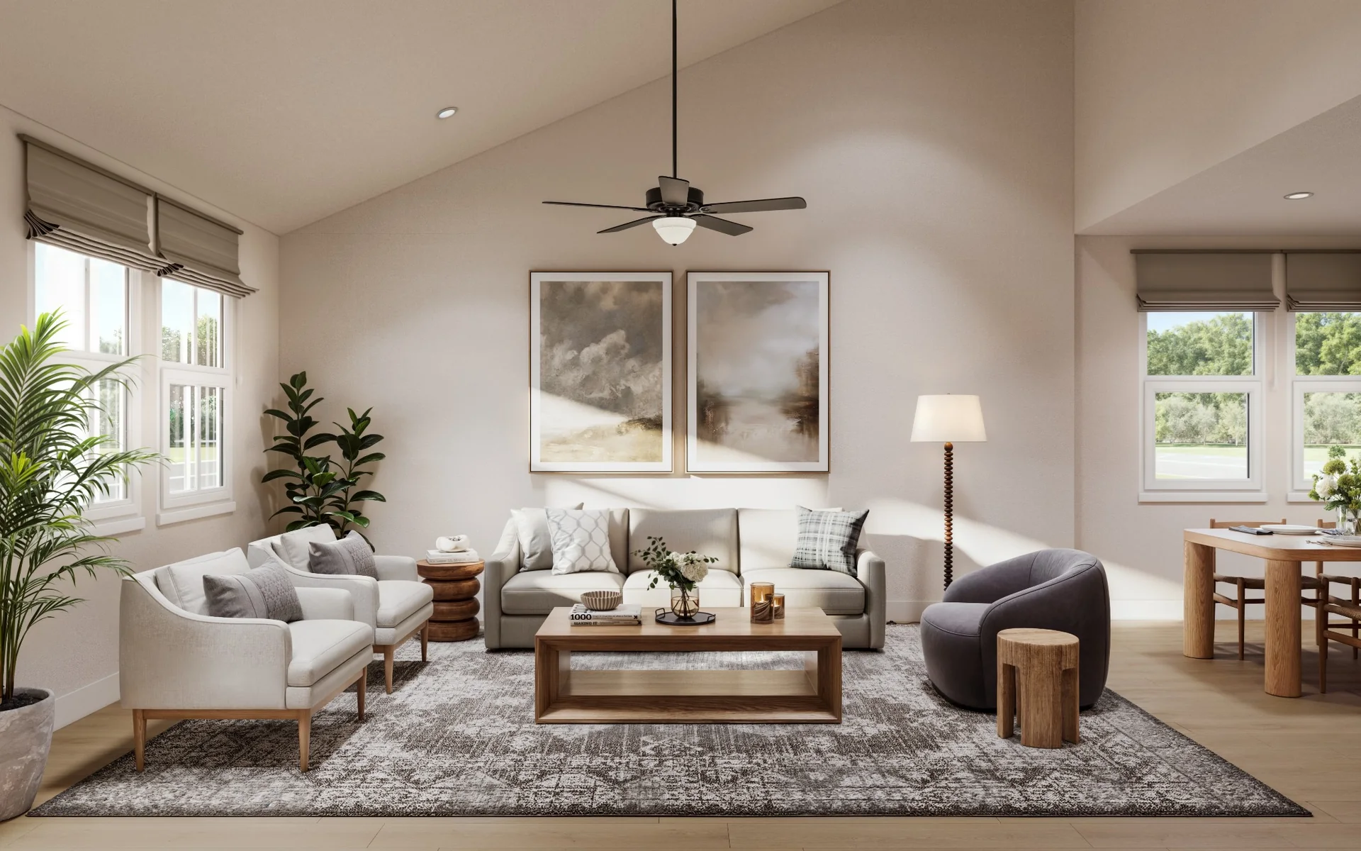 Sunlit living room in an Upward home, with a vaulted ceiling, sofa, armchair and dining area beyond