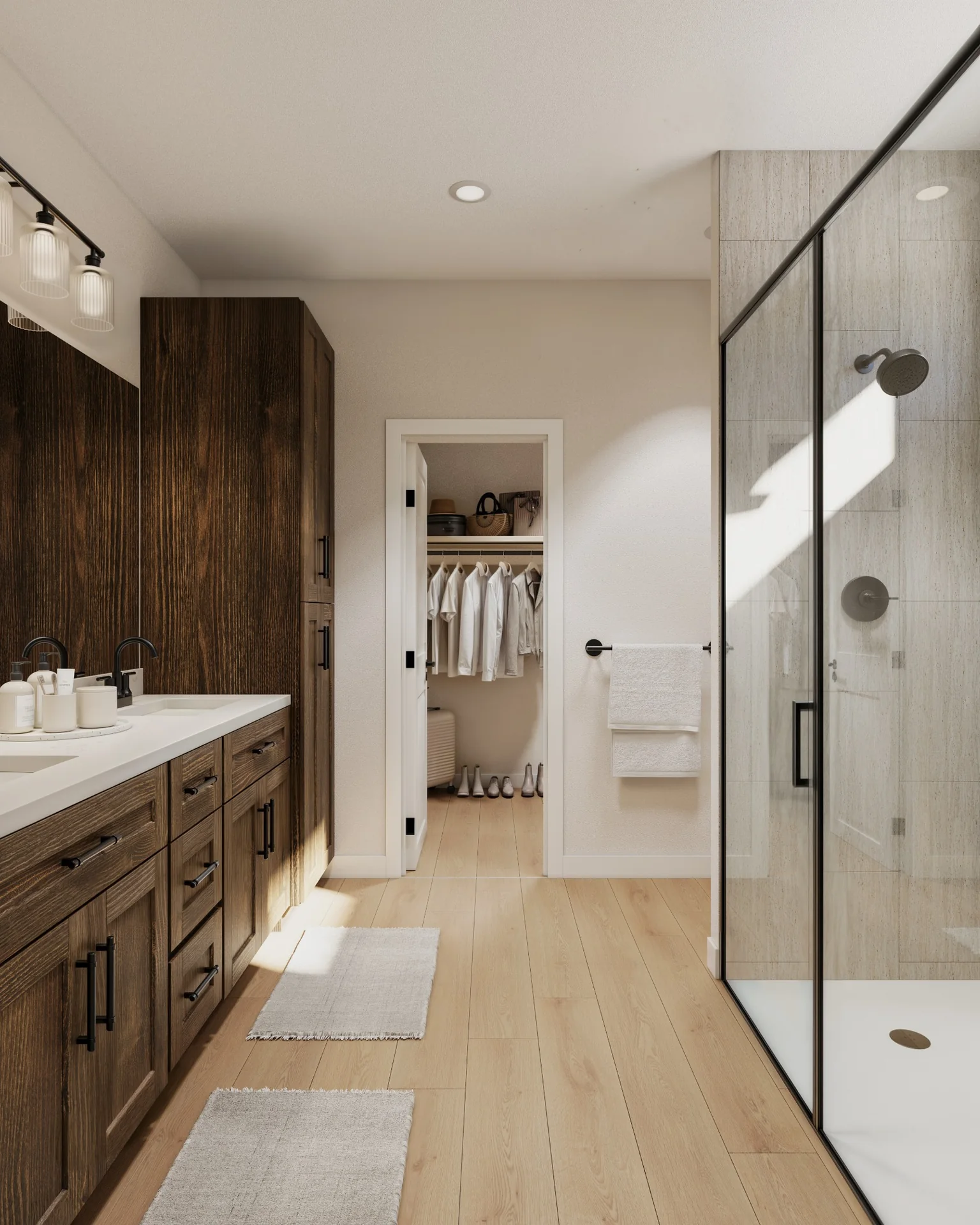 Bathroom in an Upward home, with a double vanity, walk-in shower and an adjoining closet