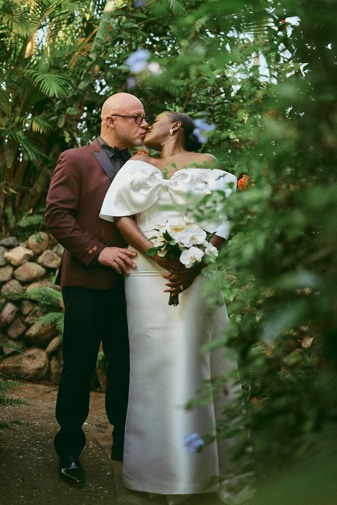 Wedding couple portrait in a lush tropical garden