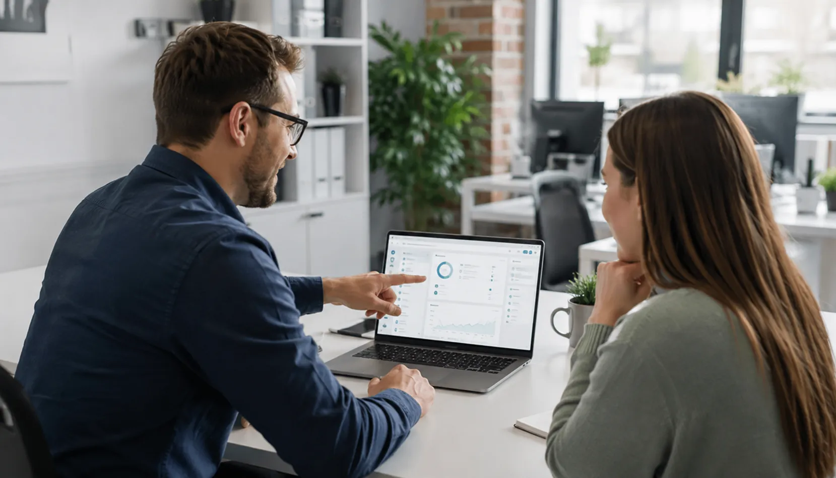 Small business professionals using technology in a modern office