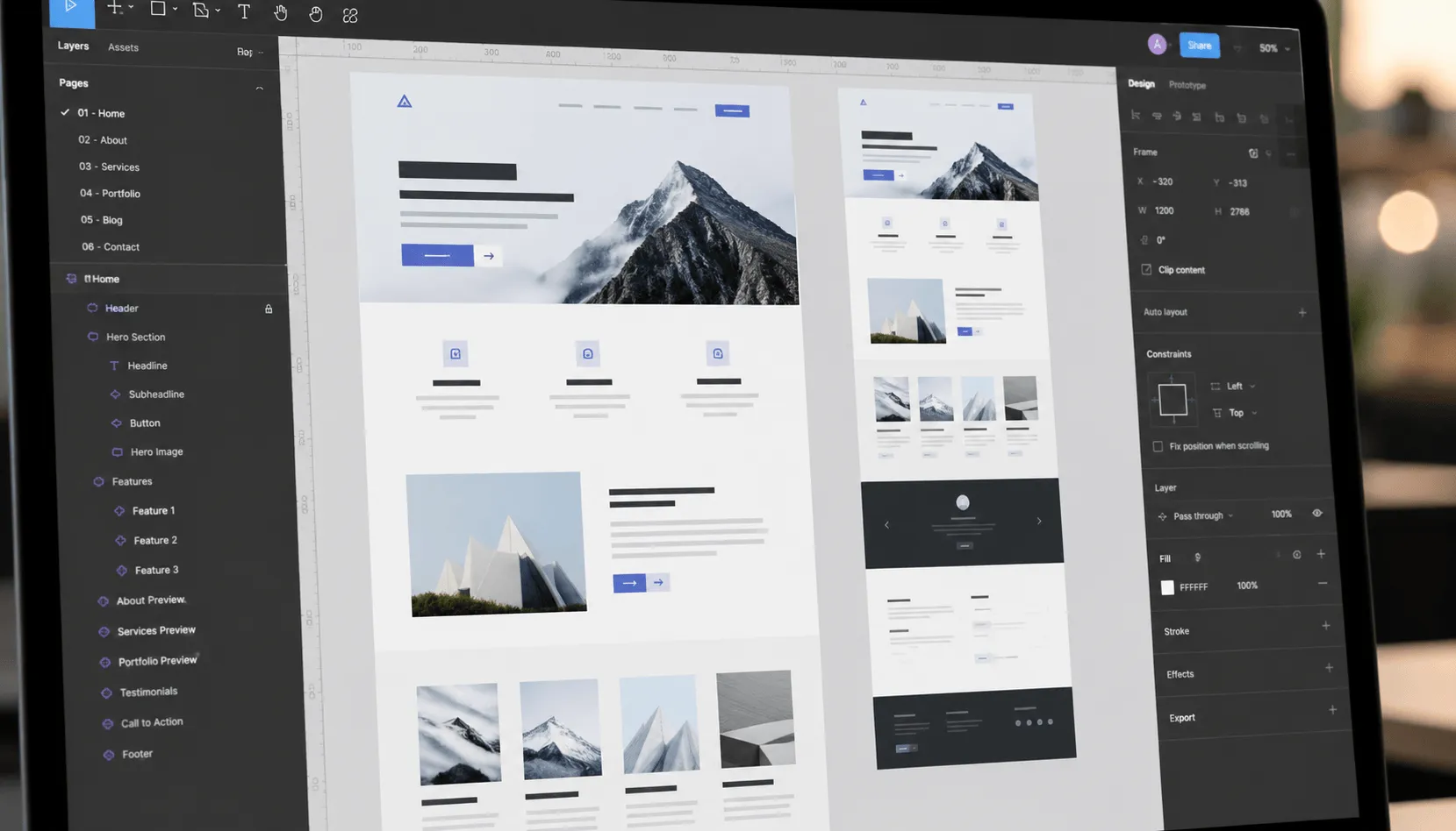 Website designer working on desktop and mobile page layouts
