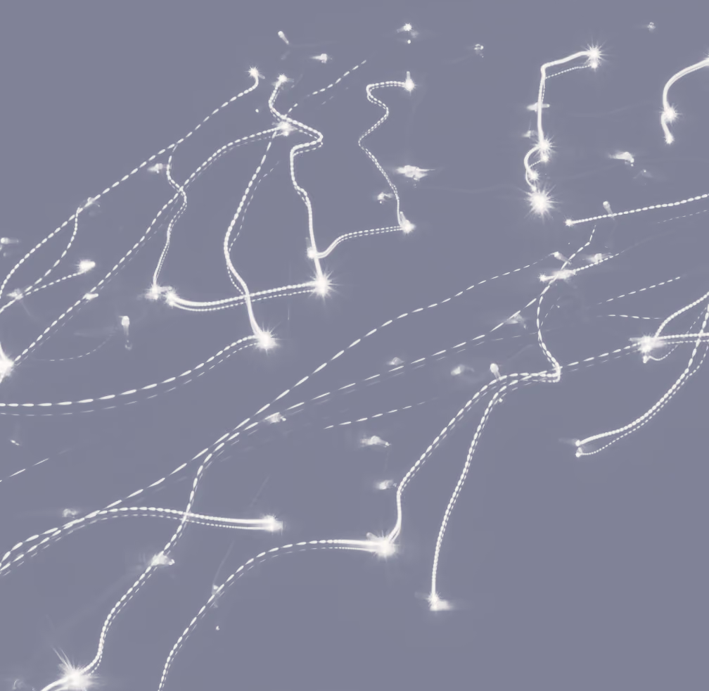 Abstract image of white dotted and dashed light trails with sparkle effects on a muted purple background.