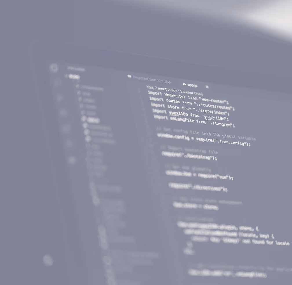 Blurred close-up of a computer screen displaying code in a text editor, showing import statements and configuration settings for a Vue.js project.