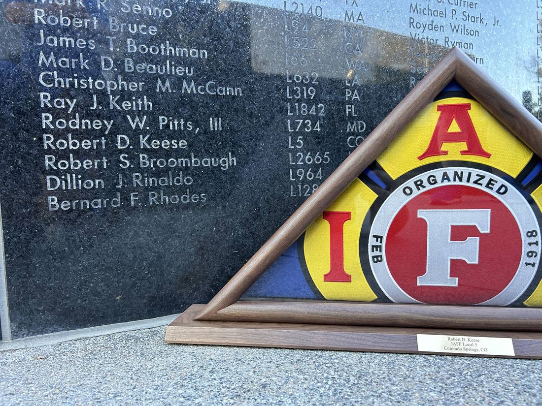 Folded flag and IAFF emblem