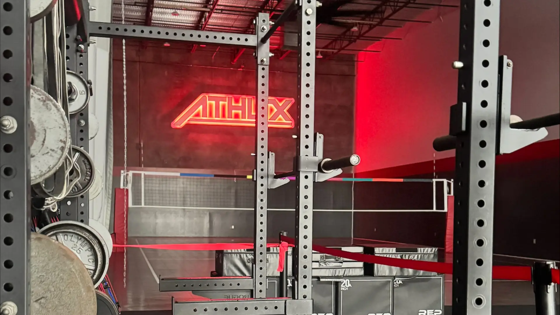 Strength training equipment and weight racks inside ATHLTX Sports Performance in Waipahu, HI.