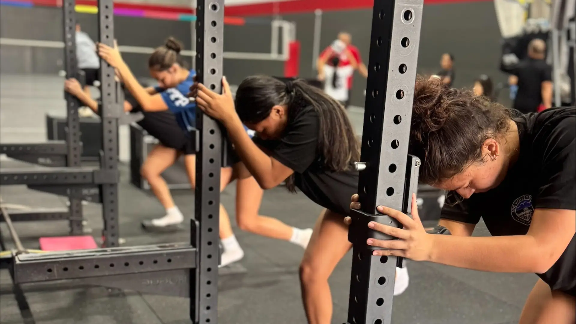 Young athletes performing mobility and injury prevention exercises at ATHLTX Sports Performance in Waipahu, HI.