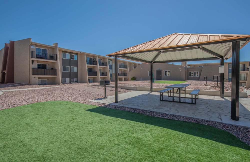 Pergola with apartment building in back