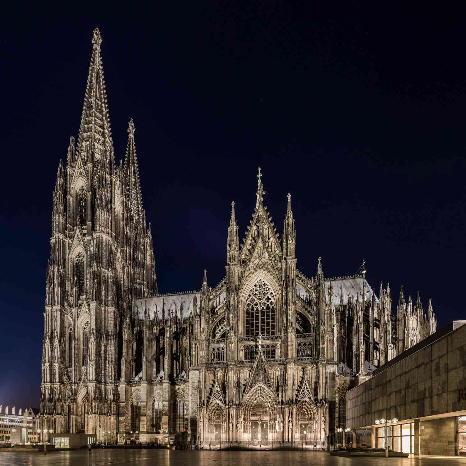 Illuminated Gothic cathedral with pointed spires