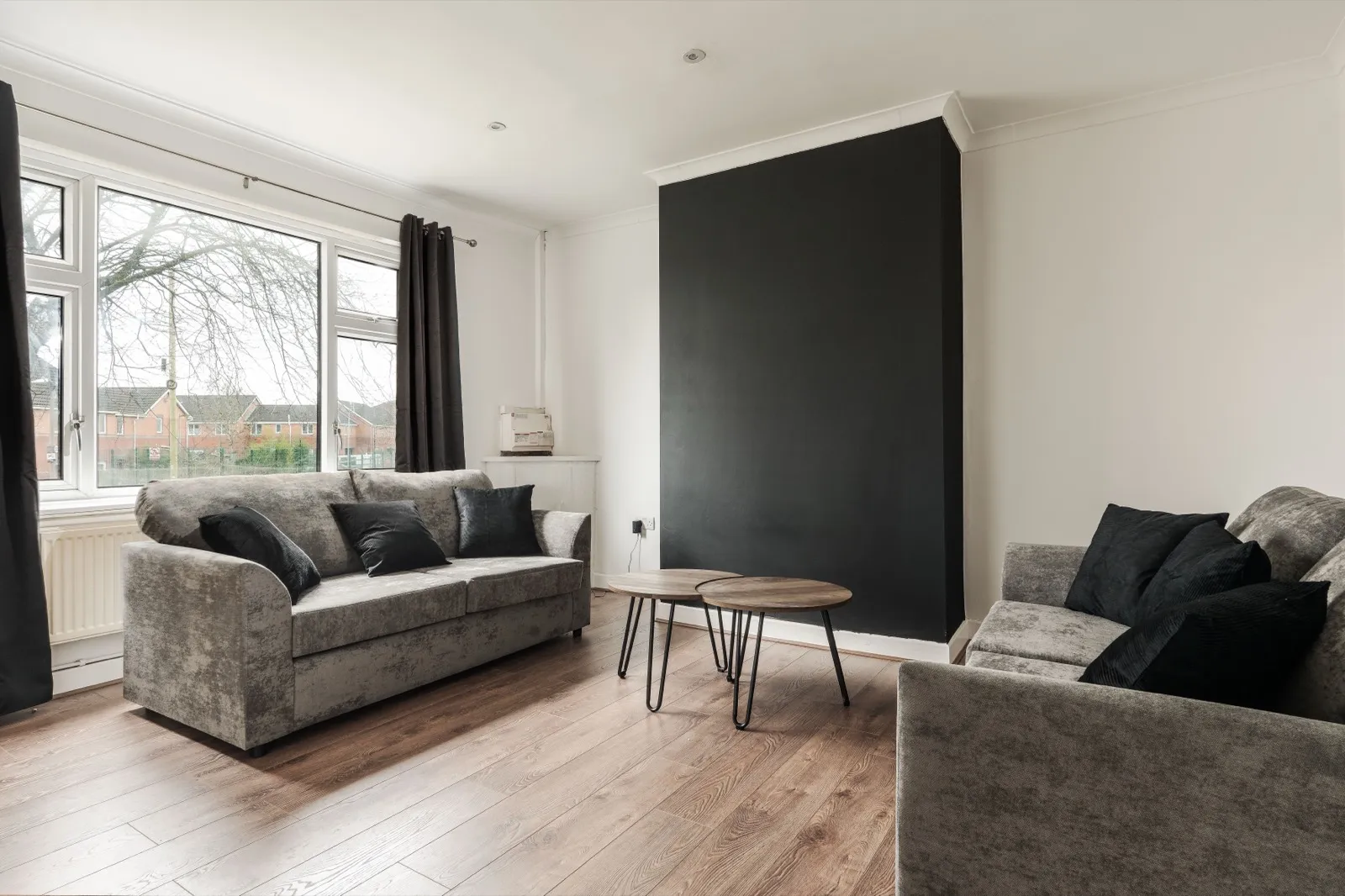 A bright, professionally styled living room in a Kammili Properties managed short-let