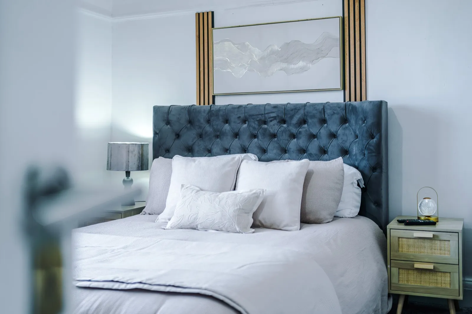 A hotel-standard short-let bedroom with fresh linen