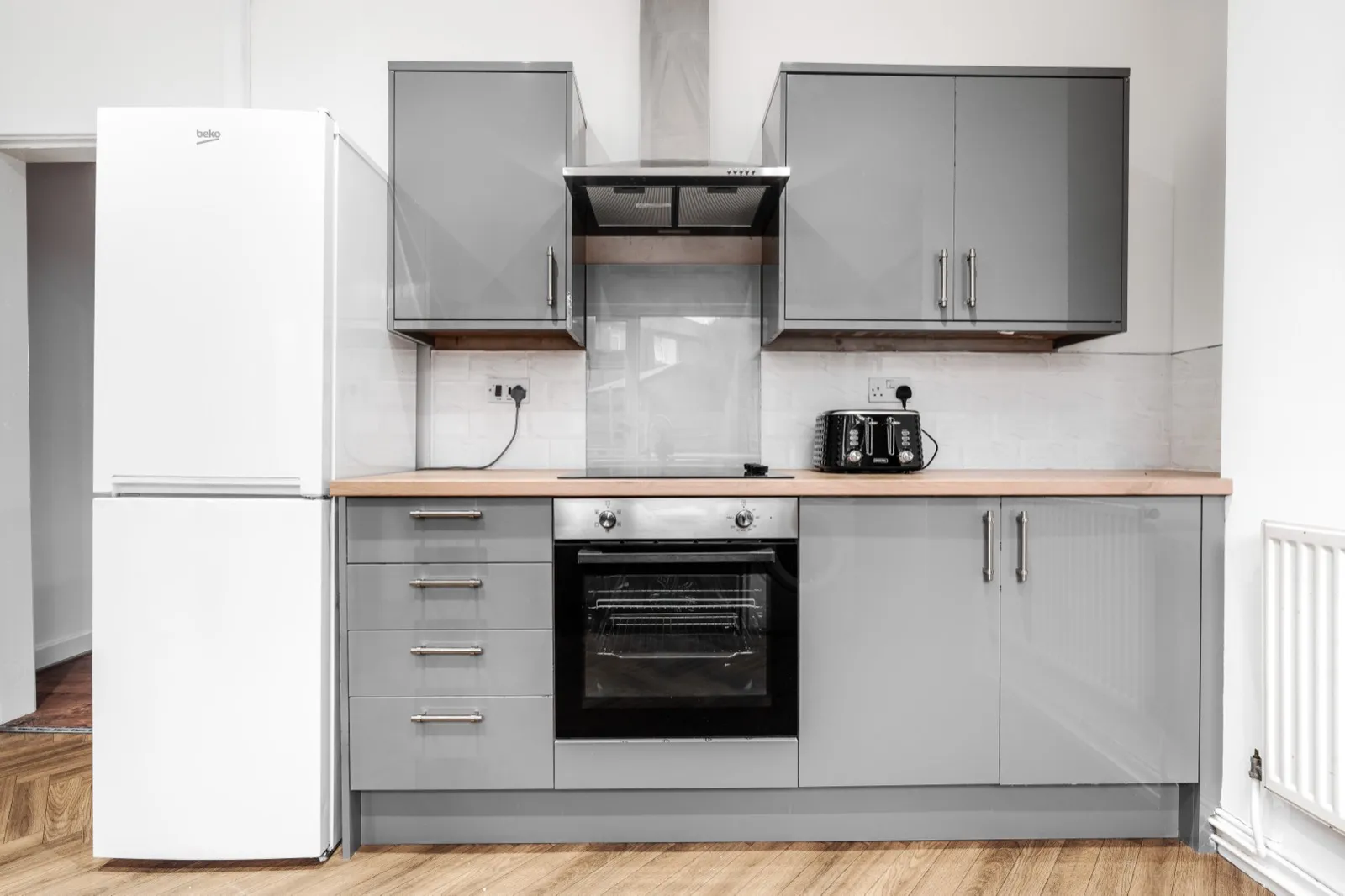 A clean, fully equipped short-let kitchen