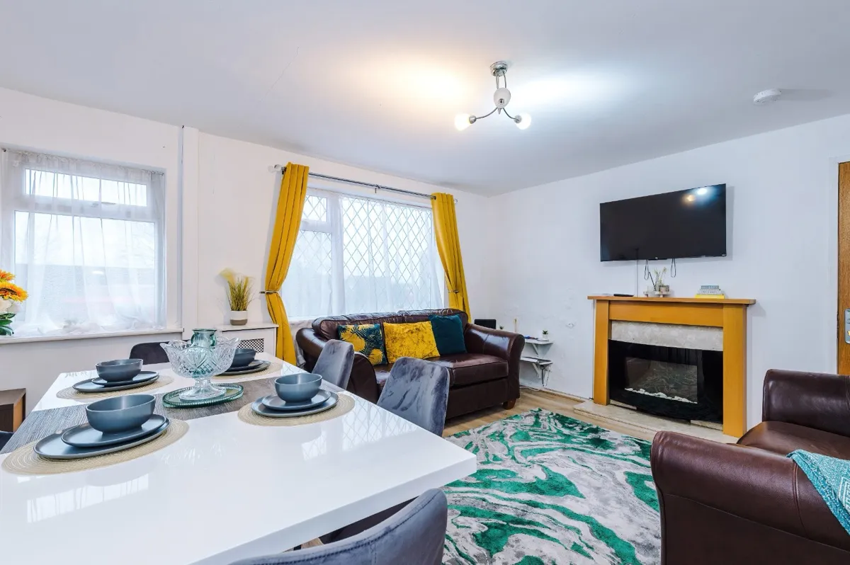 A bright open-plan living and dining room in a Westhoughton short-let managed by Kammili Properties