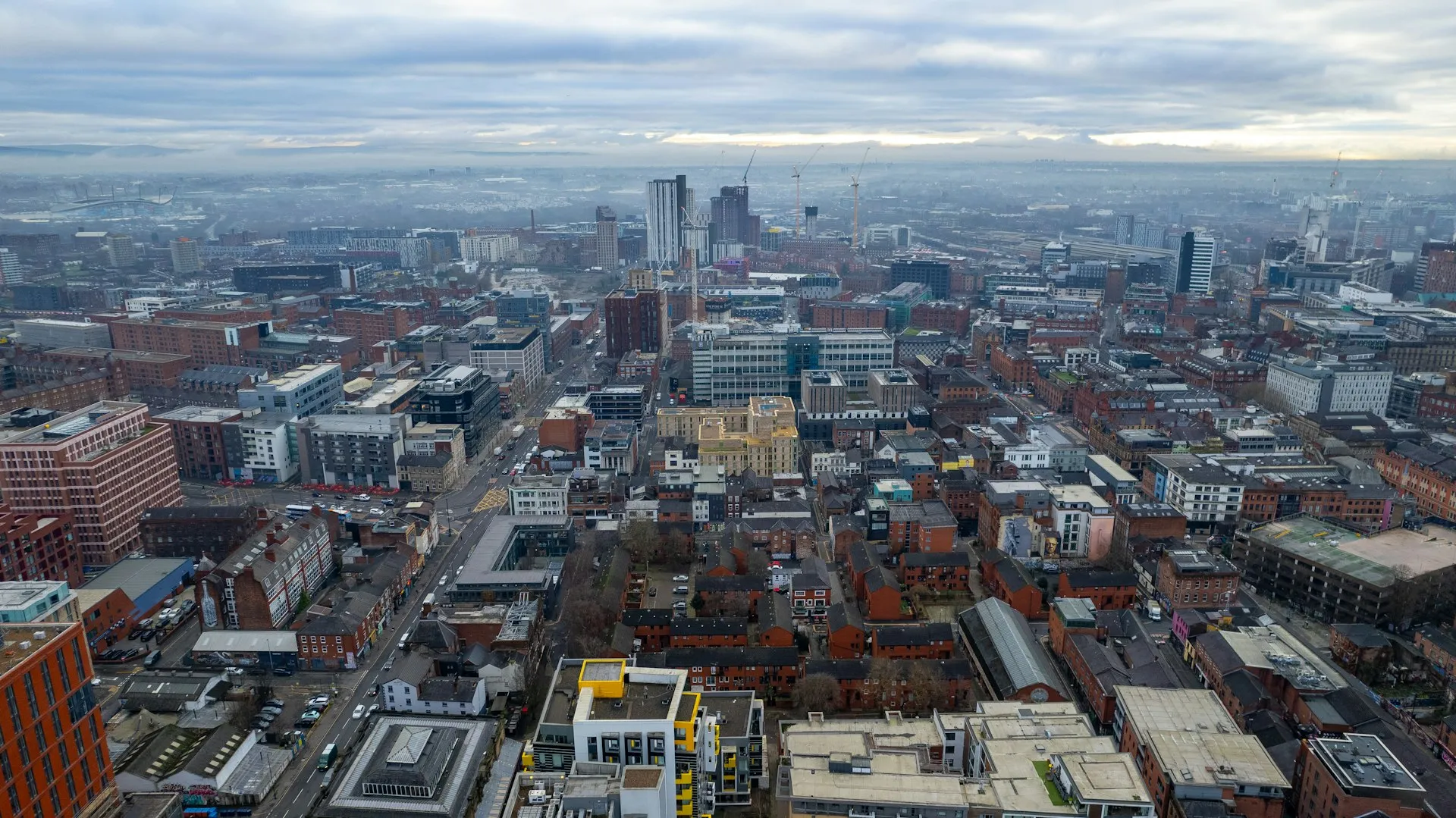 Aerial view of Manchester, representing the live local market data behind each earnings estimate