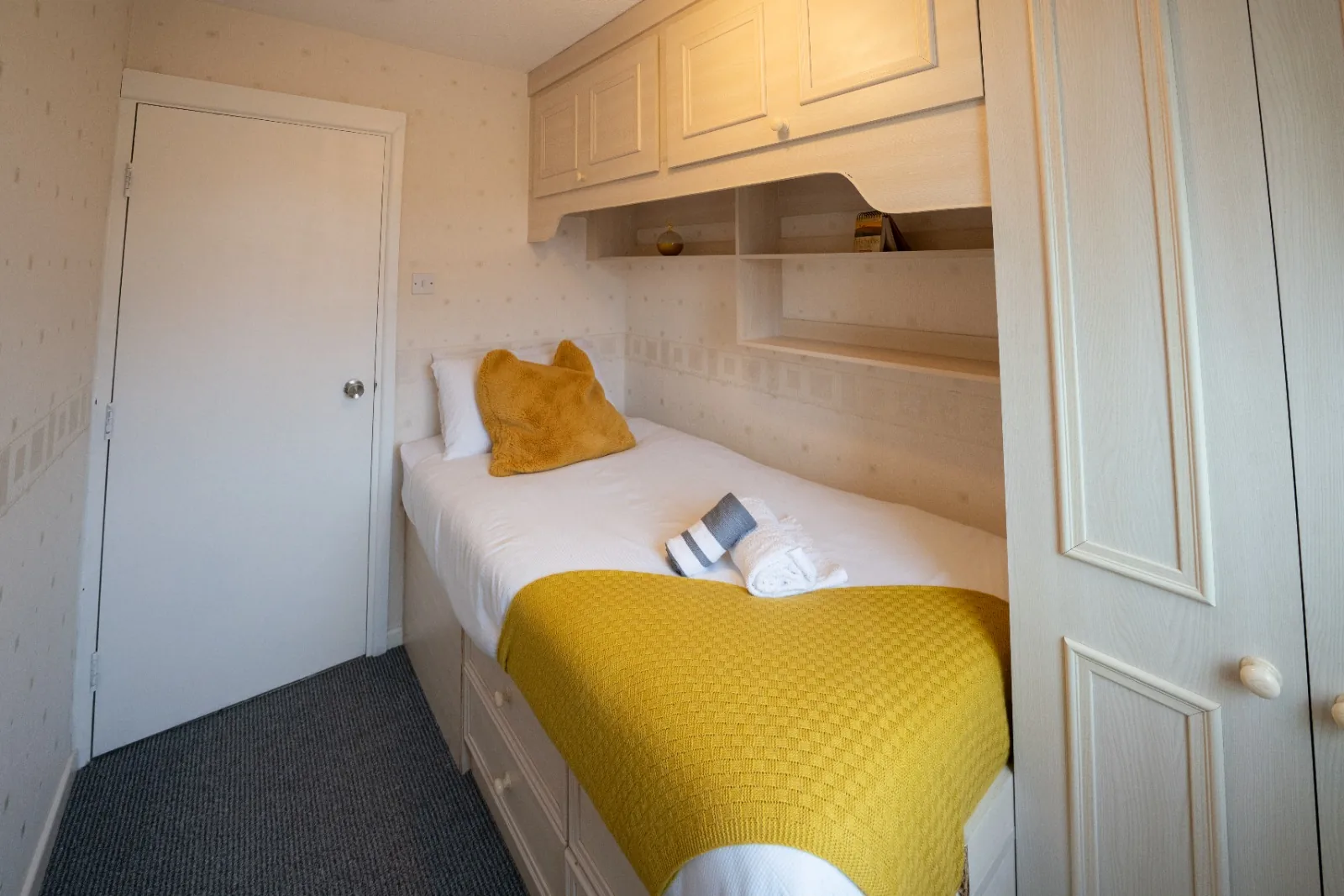 Single bedroom with fitted overhead storage at Old Vicarage in Westhoughton, Bolton