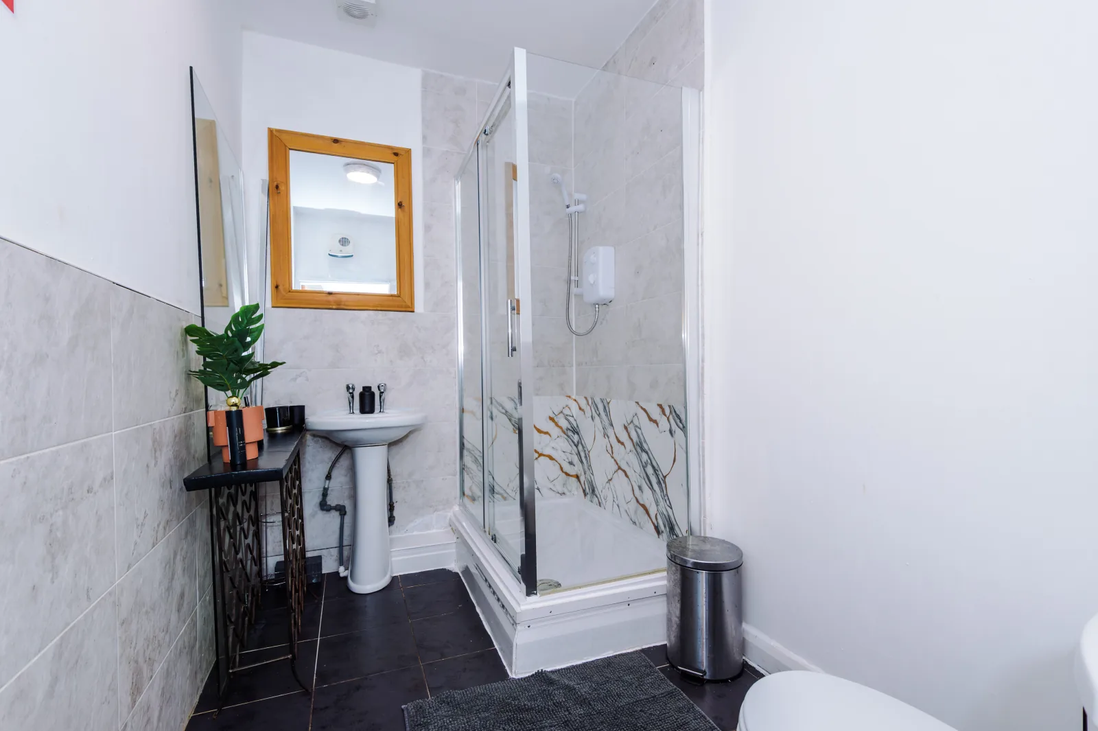 Bathroom with a shower enclosure and basin at Flat 5, Pendleton Way