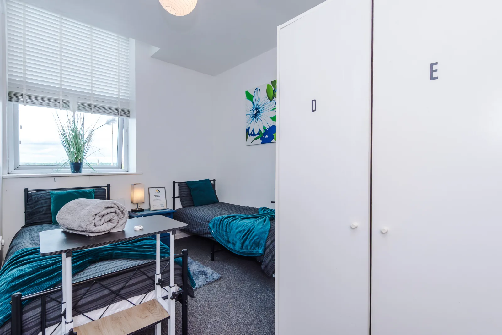 Bedroom with two single beds and fitted wardrobes at Flat 5, Pendleton Way