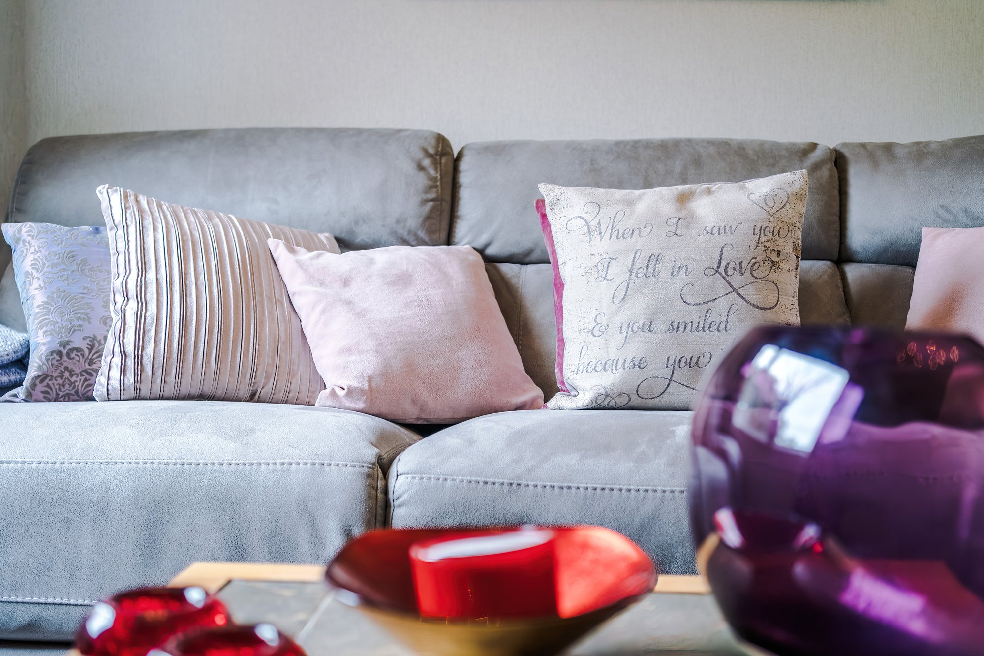Grey sofa with scatter cushions in the living room