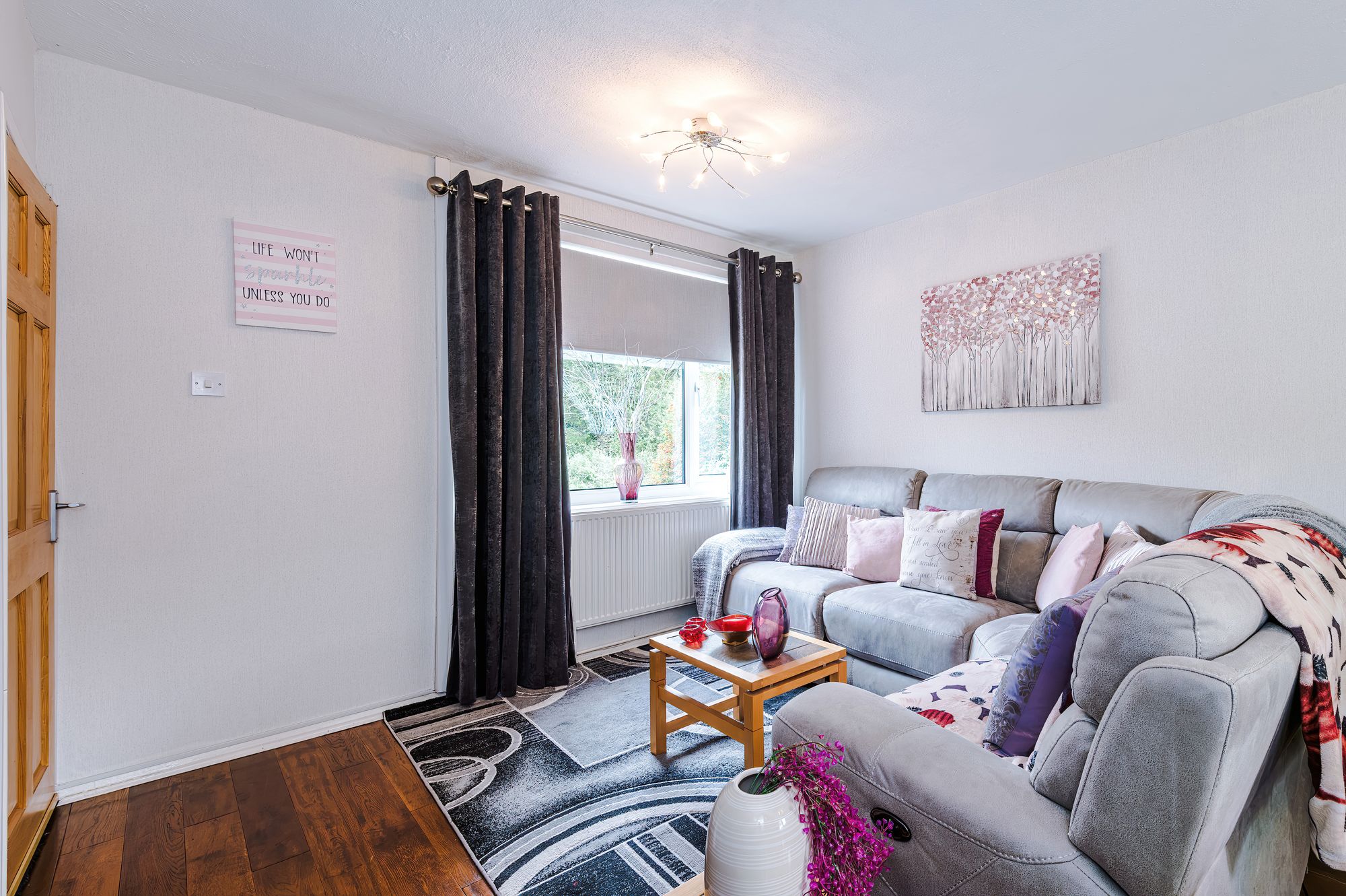 Living room with sofa, curtains and window