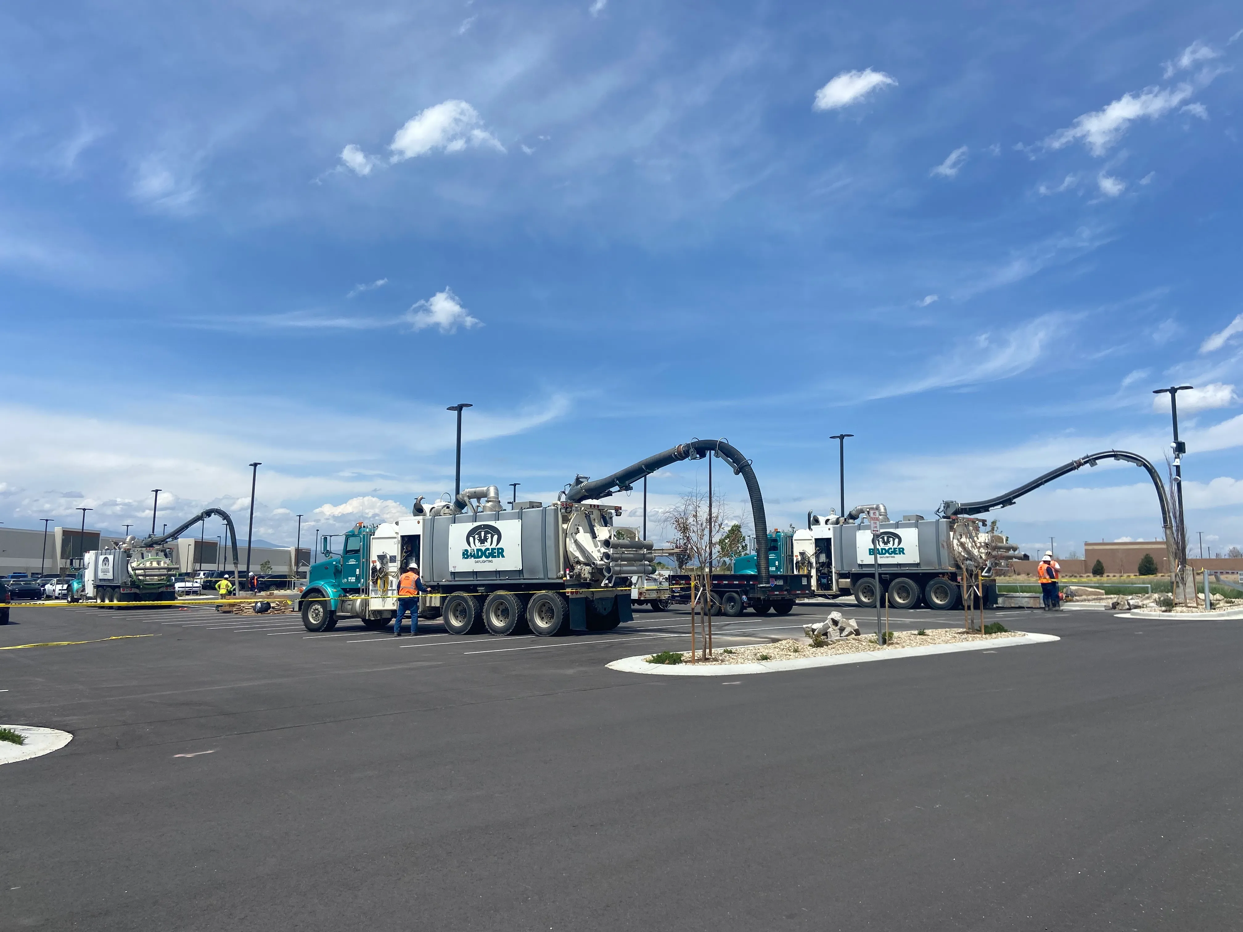 Cement trucks working at a hail netting construction project site