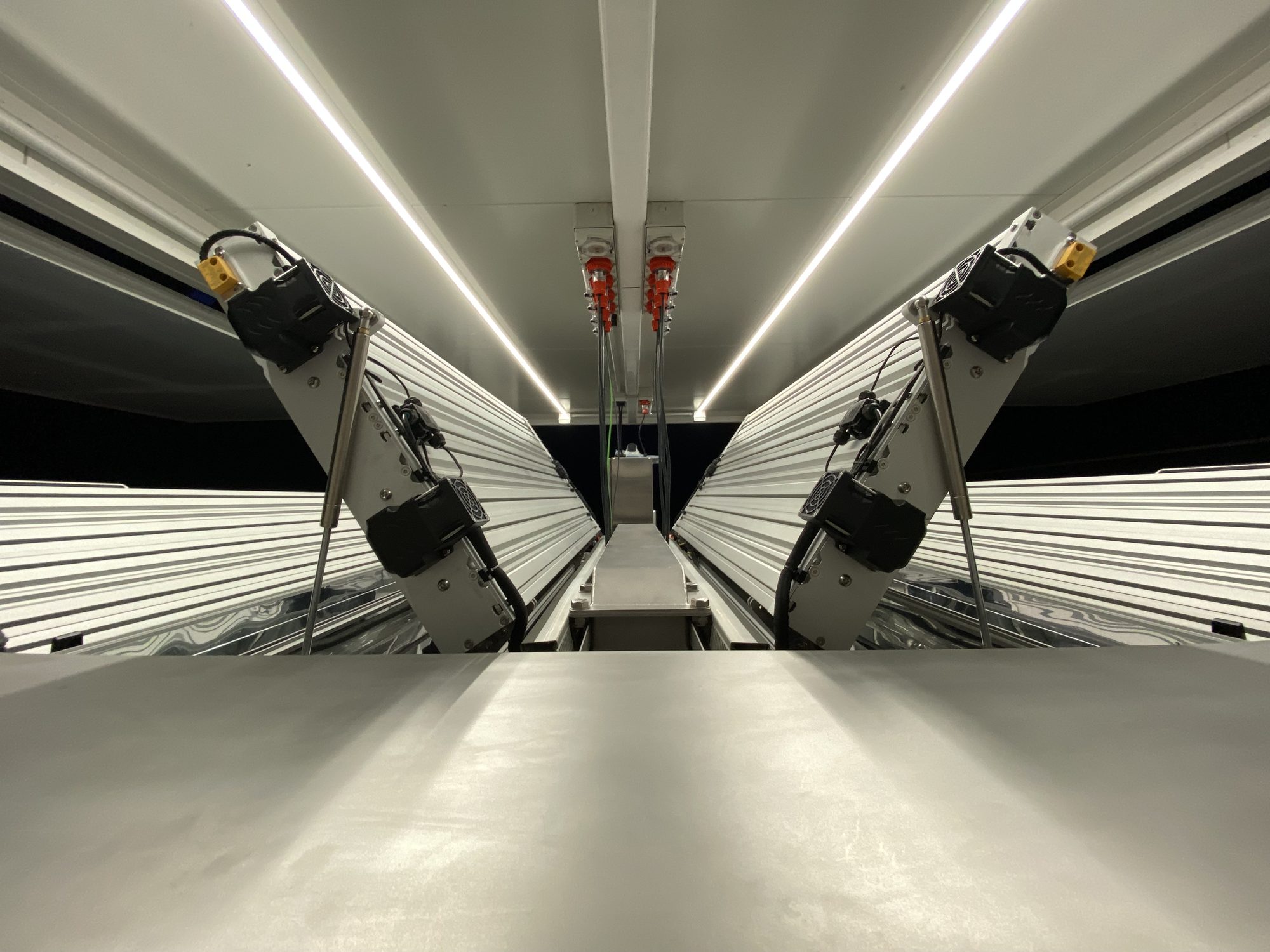 Ultraviolet lamps suspended above the treatment channel