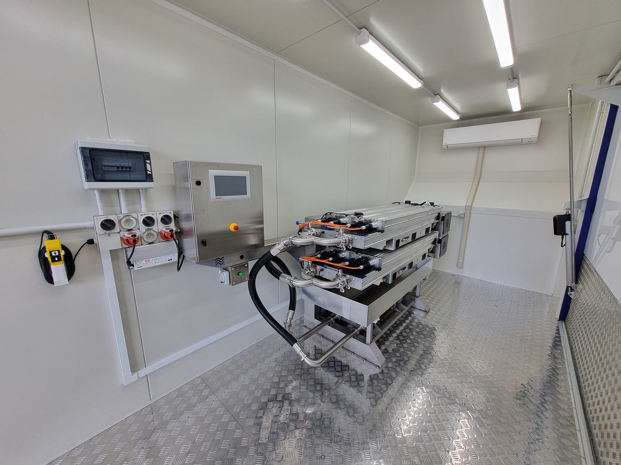 Treatment modules racked inside a containerised system