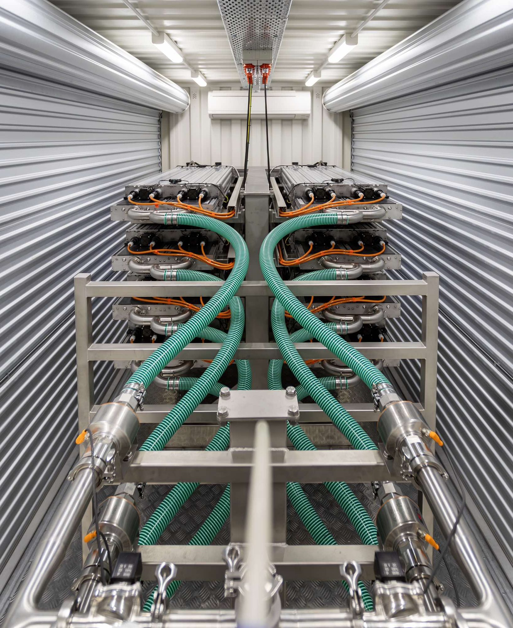 Stacked treatment modules viewed head on inside a container