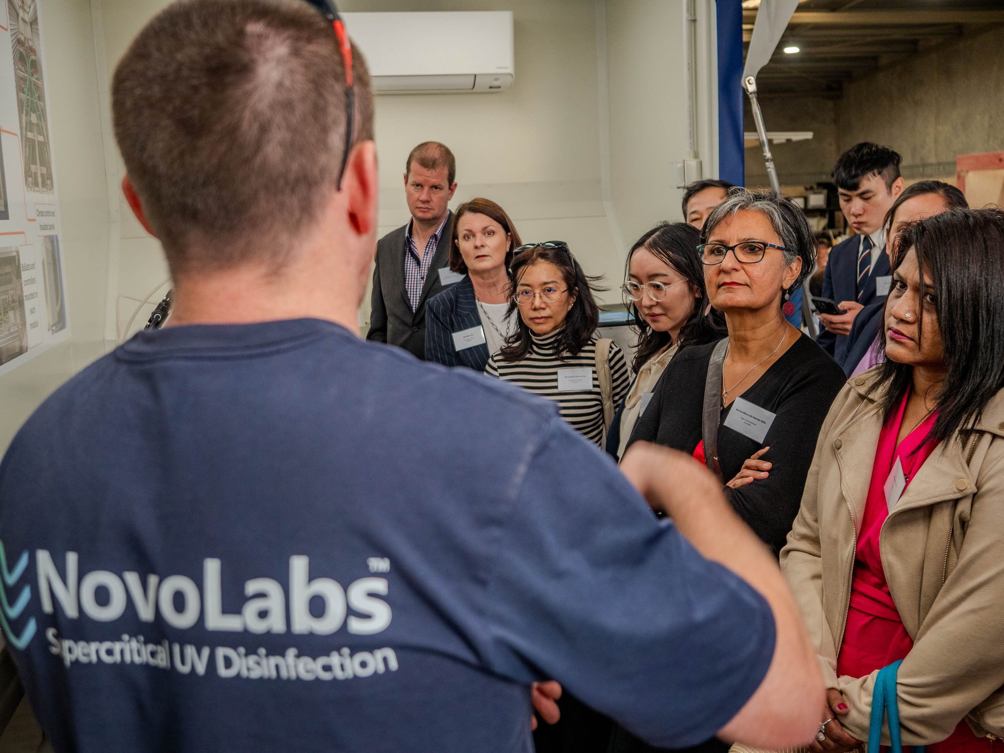 Explaining the technology to visitors at the assembly facility