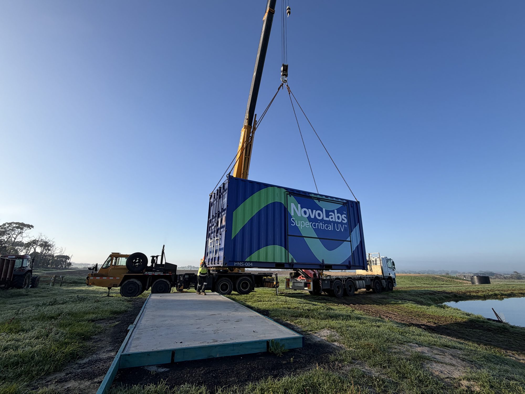Craning a unit into position at dusk