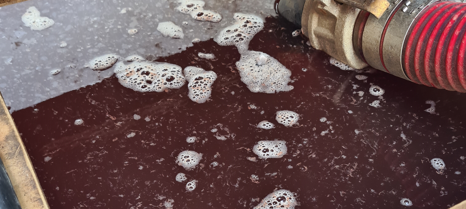 Wastewater sample discoloured by dissolved iron