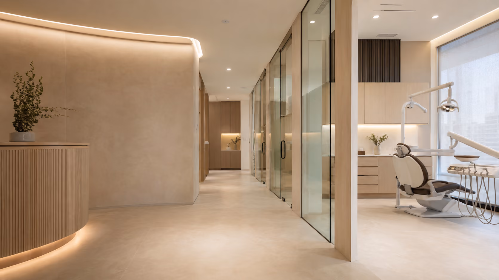 Bright modern dental clinic hallway with glass doors and a dental chair near a large window.