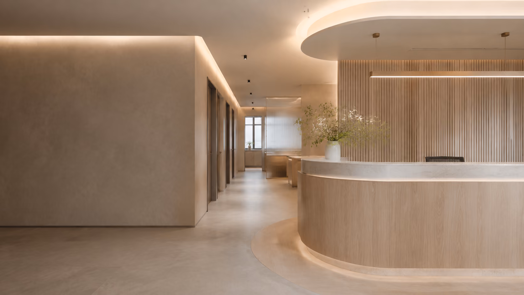 Medical clinic reception with curved wood-paneled desk and softly lit corridor