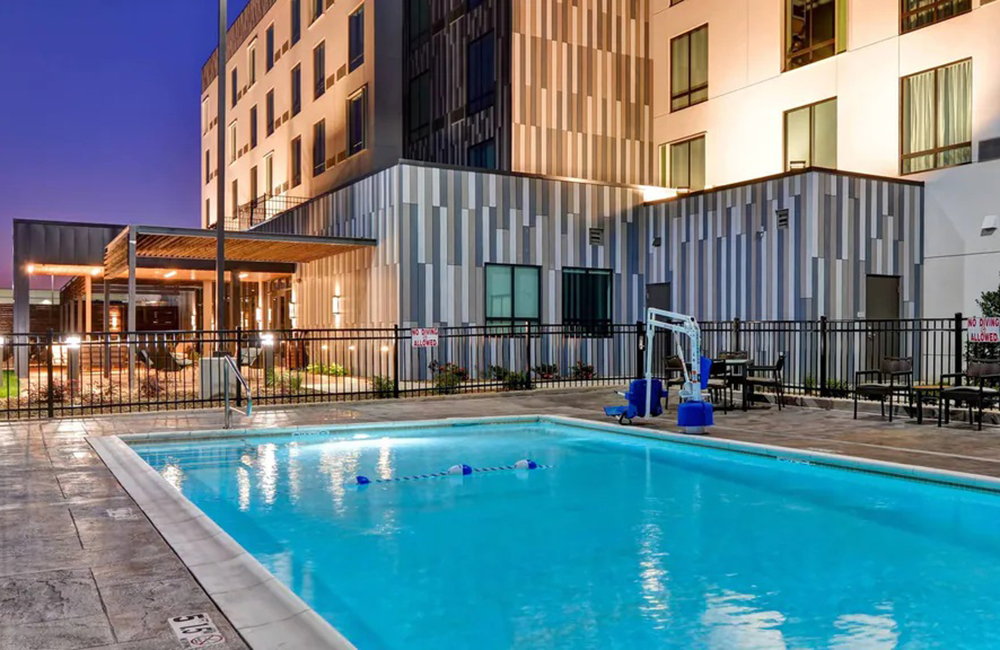 Rogcy commercial building project — exterior with outdoor pool and amenity terrace