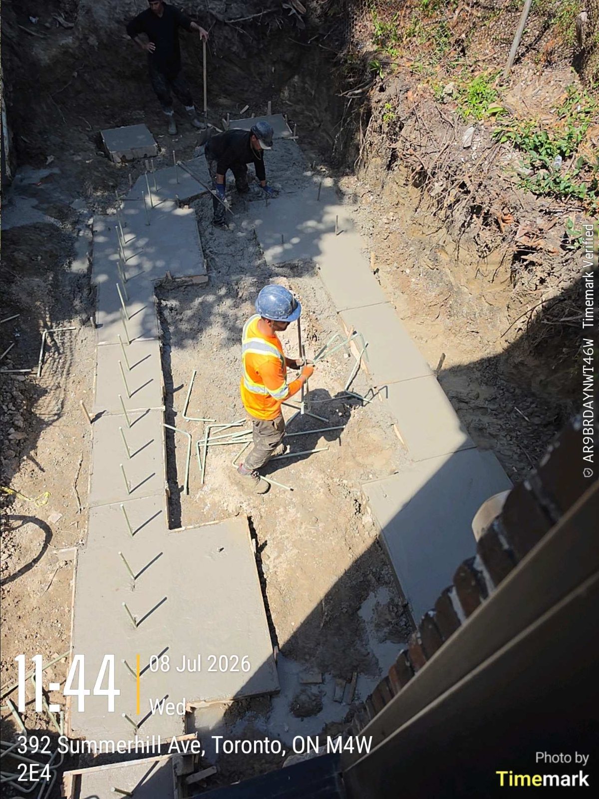 Worker on the new footings of a Toronto rear addition