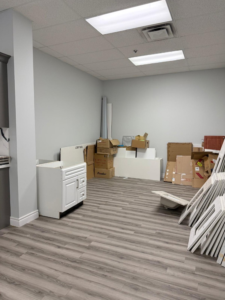 Cabinets and boxes being cleared during the medical clinic strip-out