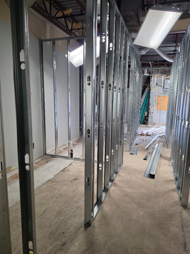 Steel stud framed corridor in a medical clinic conversion