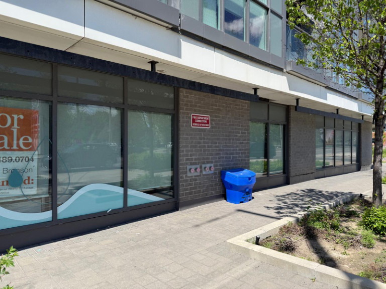 Street-level storefront of a mid-rise building for a North York clinic fit-out