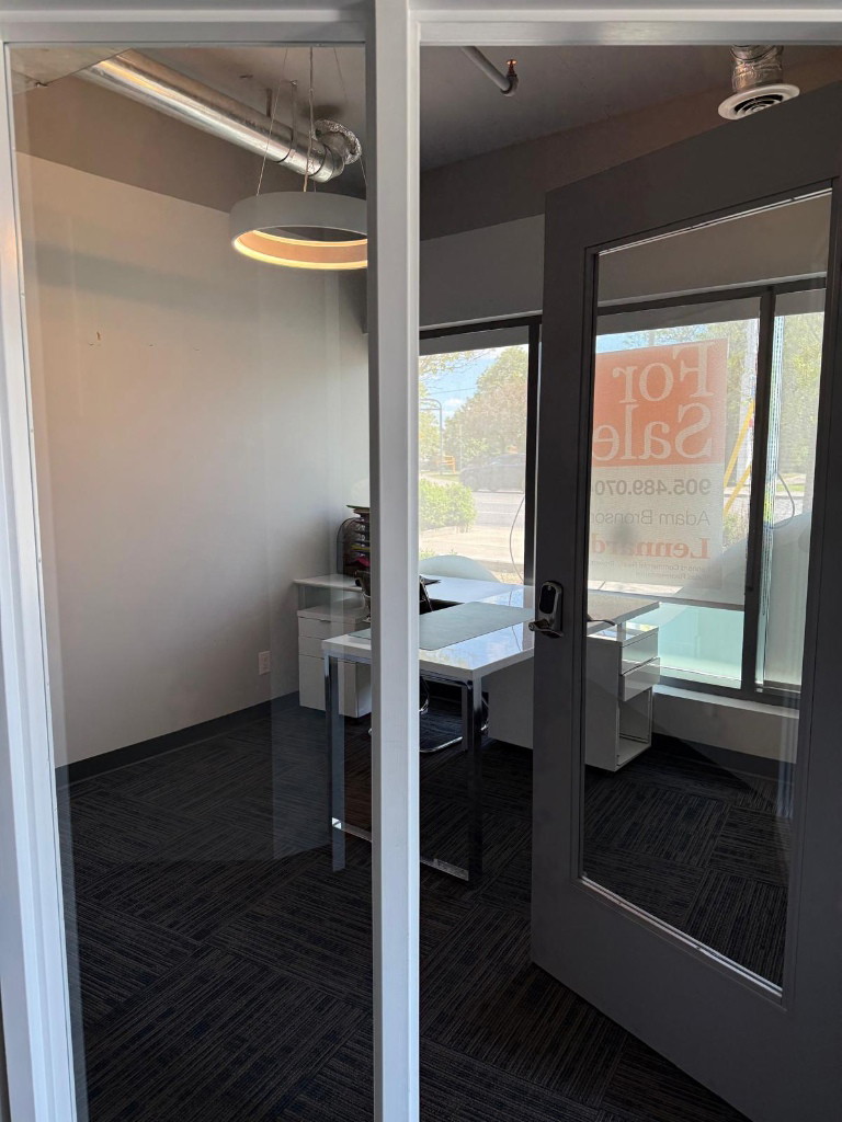 Consultation room with glass door and window in a North York clinic fit-out