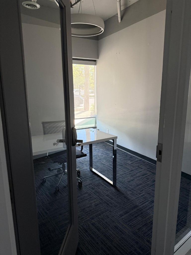 Carpeted room with window in a North York clinic interior fit-out