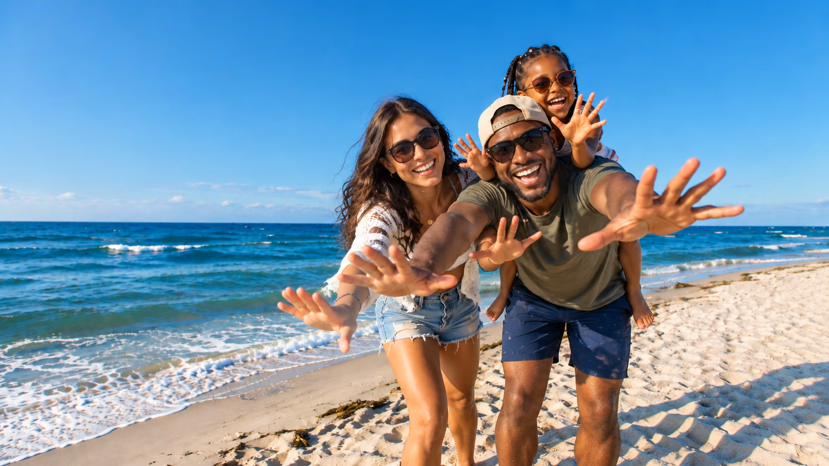 A father, mother and their daughter at the beach 