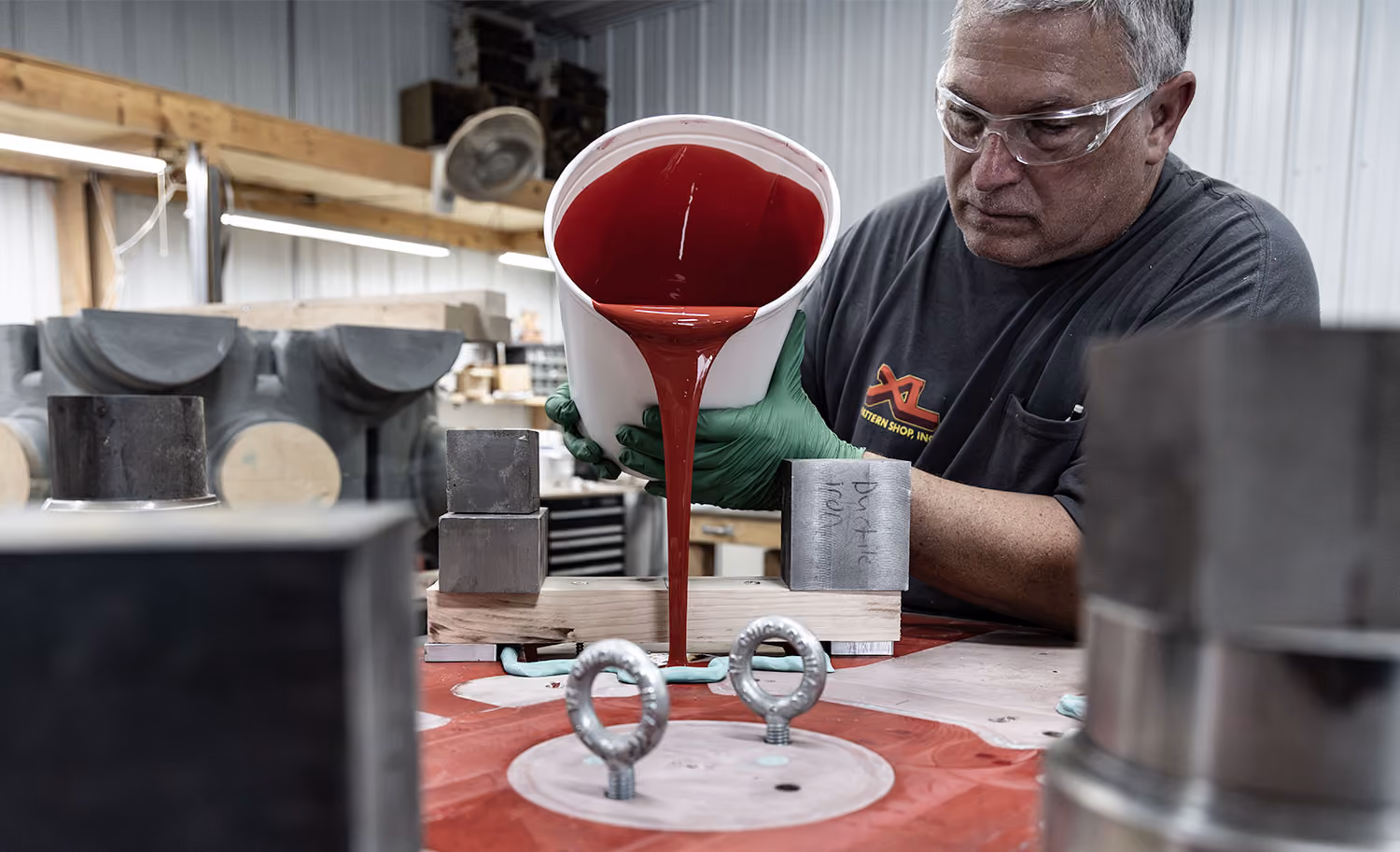 XL Pattern Shop employee pouring material into a foundry tooling mold at the Orrville, Ohio facility.