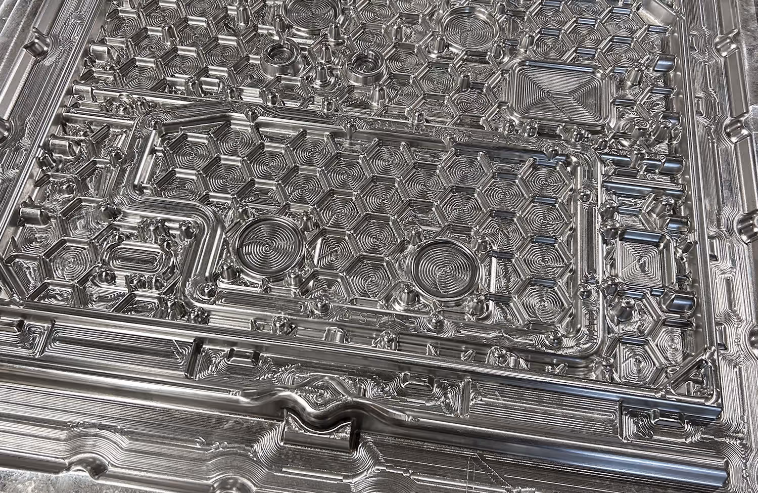 Close-up of precision-machined aluminum foundry tooling manufactured by XL Pattern Shop.
