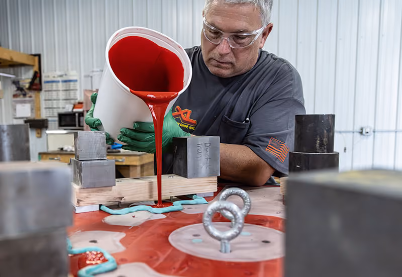 XL Pattern Shop technician pouring urethane to create custom foundry tooling.