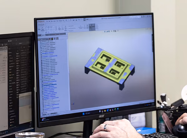 Alt text: Engineer designing custom foundry tooling in CAD at XL Pattern Shop.
