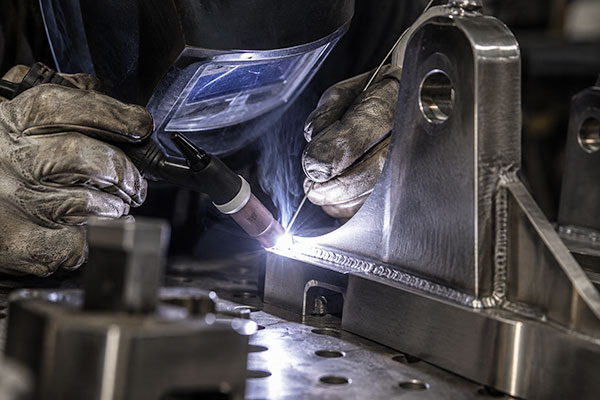 Metal fabrication and precision welding of a machined component for prototype and short-run production