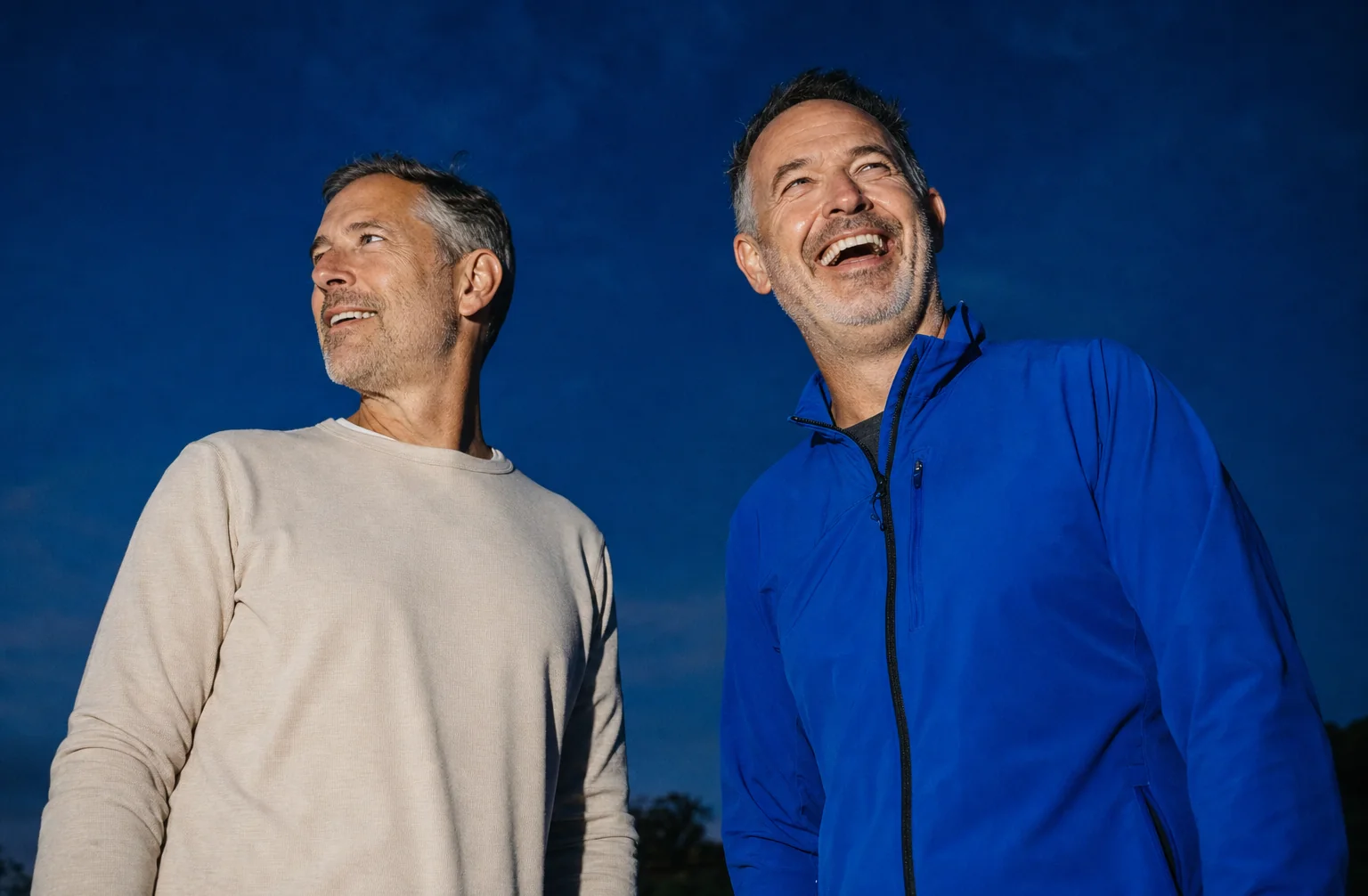 Two Science and Co members outdoors at blue hour